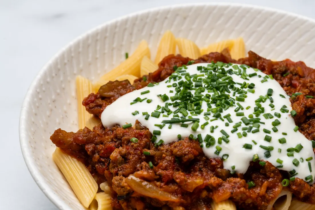 Pasta with slow-cooked beef ragù and chives
